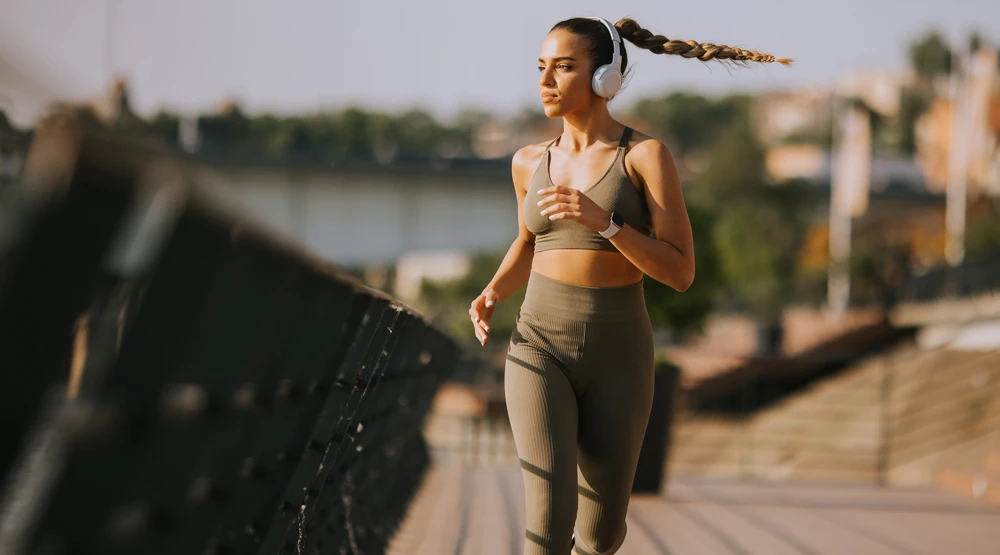 A woman jogging near a lake