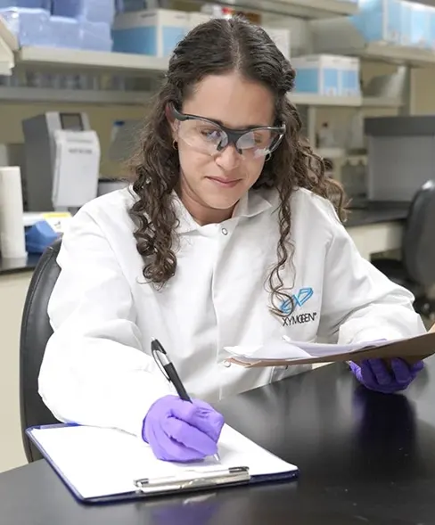 Female scientist manipulating test tubes