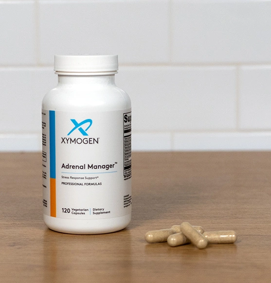 Bottle of XYMOGEN Melatonin CR on table