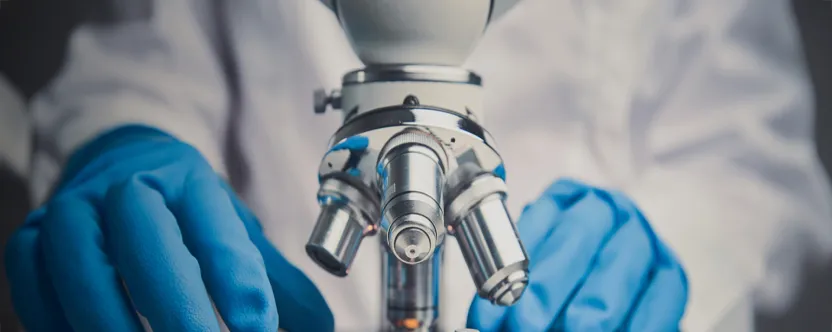 Man working at a microscope