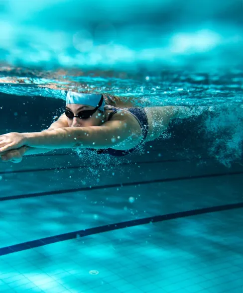 Woman swimming in pool