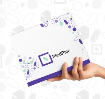 Hand holding MedPax box