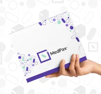 Hand holding MedPax box