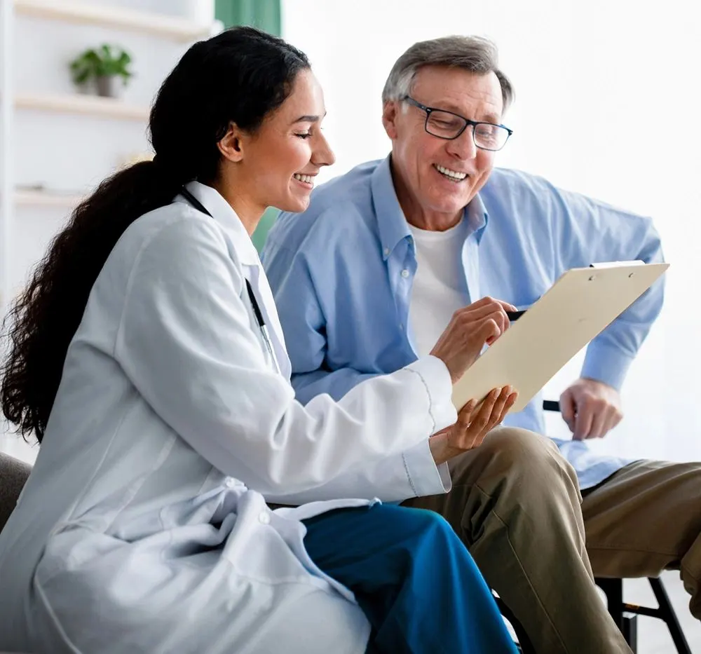 Doctor talking to senior patient